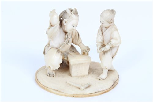 Lot 676 - Late 19th century Japanese carved ivory figure...