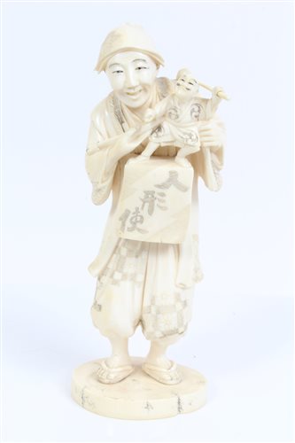 Lot 667 - Late 19th century Japanese carved ivory figure...