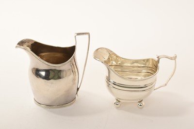 Lot 456 - George III silver cream jug of plain oval form London 1797, together with a Georgian style silver cream jug London 1899, approximately 6.5oz gross (2)