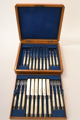 Lot 458 - Victorian silver and mother-of-pearl handled fruit knives and forks comprising 12 knives and 11 forks in fitted oak case Sheffield 1885.