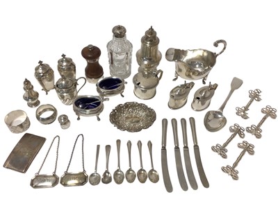 Lot 460 - Group of silver tablewares to include a silver sauce boat, four silver mustard pots, silver condiments, set of four Victorian silver knife rests, silver sugar caster, and sundry items