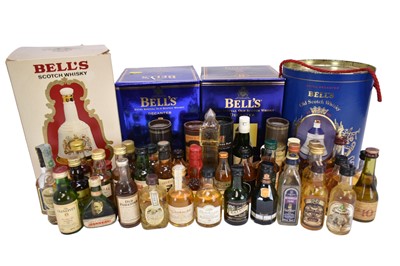 Lot 52 - Forty-seven bottles, to include thirty three Whisky miniatures and four Bells Whisky decanters with contents in boxes