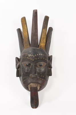 Lot 821 - 19th century Nepalese wooden and polychrome painted mask