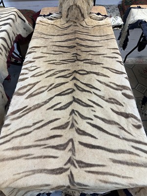 Lot 869 - Fine 1940s Van Ingen Tiger skin rug, the underside numbered 31708 with records stating it was delivered to Van Ingen on July 23rd 1945 by Sir William Ibbotson. 313cm nose to tail, 212cm paw to paw.