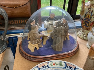 Lot 62 - Group of ceramic monks under a glass dome