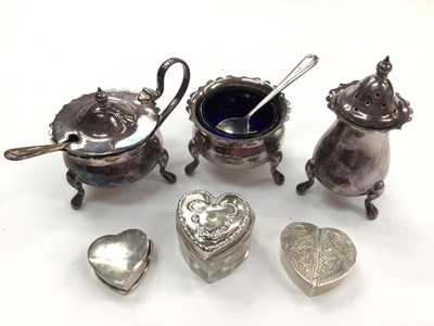 Lot 1009 - Silver three piece creut set and three silver heart shaped pill boxes