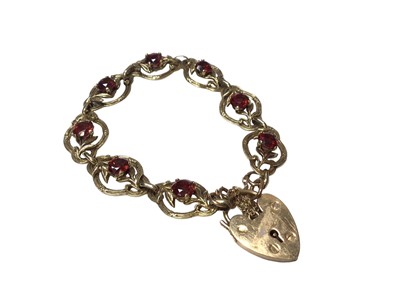 Lot 75 - 9ct yellow metal and garnet set bracelet with 9ct gold padlock clasp