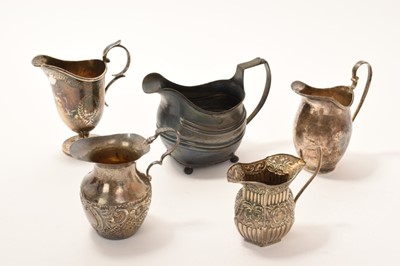 Lot 218 - Five silver cream jugs