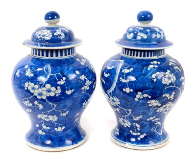 Lot 9 - Pair of 19th century Chinese blue and white baluster vases and covers