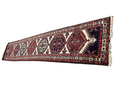 Lot 1329 - Turkish runner, having seven hexagonal medallions, on cream ground, 380 x 76cm