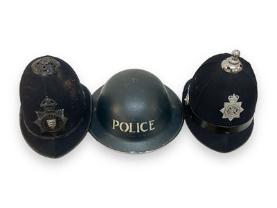 Lot 729 - Second World War Police tin helmet together with an Essex Police cloth helmet and a Wiltshire Police Constabulary helmet (3).