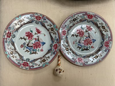 Lot 98 - Pair of Chinese famille rose plates, Yongzheng period, decorated with birds and flowers on a patterned ground