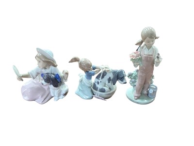 Lot 1150 - Group of Lladro figures including children with dogs