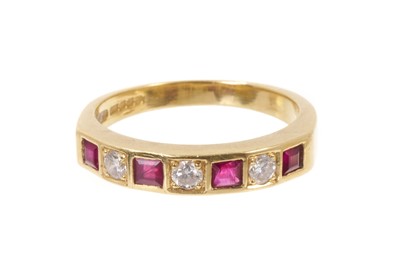 Lot 455 - Diamond and ruby 18ct gold eternity ring