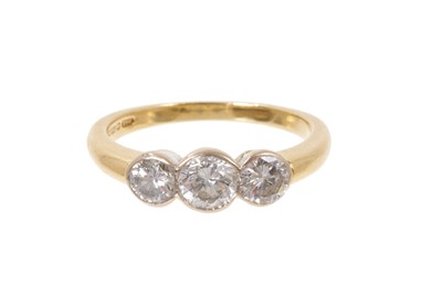 Lot 454 - 18ct gold three-stone diamond ring