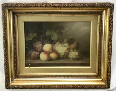 Lot 129 - After Edward Ladell, oil on wood board - Still life with peaches, pear and grapes with vines on a marble ledge, 24cm x 34cm, behind glass in gilt frame