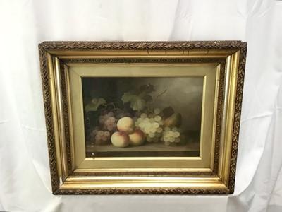 Lot 129 - After Edward Ladell, oil on wood board - Still life with peaches, pear and grapes with vines on a marble ledge, 24cm x 34cm, behind glass in gilt frame