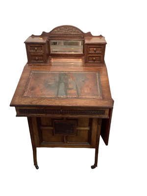 Lot 1283 - Late Victorian Davenport with leather lined slope and four side drawers enclosed by panelled door