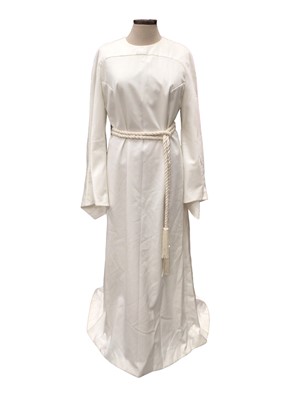 Lot 2051 - 1960s Vogue Special Design white stain wedding dress with long, wide pointed sleeves, buttoned back and a small train, with a cream rope wrist and simulated seed pearl belt, together with a matchin...