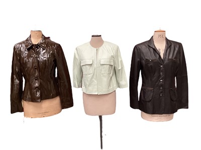 Lot 2067 - Four Worth leather jackets to include dark brown, cropped pale green, brown patent and a red coat, all size US 8