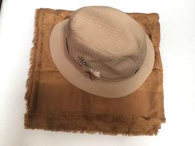 Lot 2083 - Louis Vuitton dark gold silk and wool monogram shine scarf, together with a Burberrys bucket hat, size XL