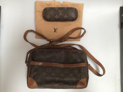 Lot 2088 - Vintage Louis Vuitton brown canvas and leather monogram crossbody bag and a matching sunglasses case, with dust bag