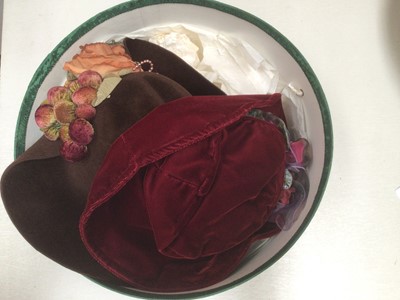 Lot 2103 - Group of women's hats including five straw sun hats, two wide brim occasions hats, navy straw hat with ribbon and silk flowers, cream turban style hat, black sequin skull cap and four felt hands, w...