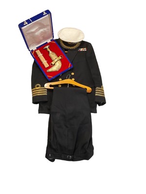 Lot 774 - Elizabeth II Royal Navy officers uniform comprising jacket, trousers and cap, together with a Middle Eastern Jambiya dagger in fitted case.