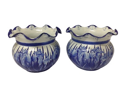 Lot 75 - Pair of Japanese blue and white porcelain jardinières, decorated with flowers, 33.5cm diameter x 27cm high