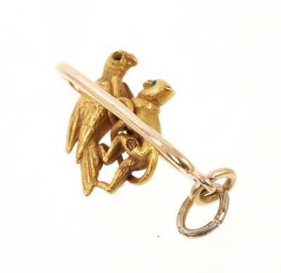 Lot 412 - 19th century gold novelty charm in the form of a monkey and a parrot on a perch