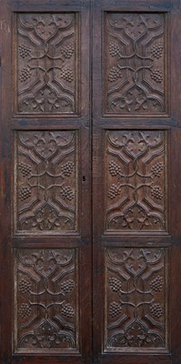 Lot 1250 - Pair of carved oak doors, utilising early panels, probably 16th century