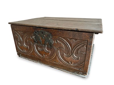 Lot 1258 - 17th century carved oak bible box with hinged cover and scroll relief carved sides, 54cm wide