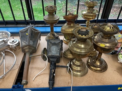 Lot 255 - Two antique carriage lamps and seven vintage brass oil lamps