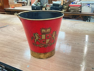 Lot 434 - Reproduction toleware fire bucket decorated with a coat of arms.