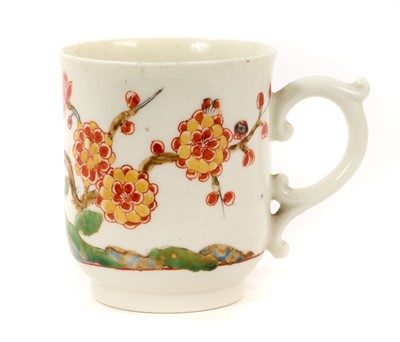 Lot 96 - Rare Mid 18th century English porcelain coffee cup, possibly Worcester, of 'U' shape, 'C' scroll handle with scroll thumbpiece, painted in Japanese Kakiemon style with flowering prunus