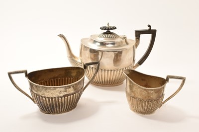 Lot 248 - Edwardian silver three piece teaset by Walker & Hall, with half fluted body (Sheffield 1903)