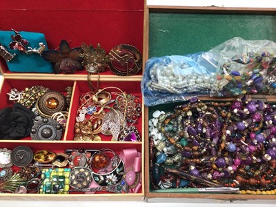 Lot 1088 - Two jewellery boxes containing silver brooches, paste set brooches, beads and other costume jewellery, together with vintage scarves, dressing table set and bijouterie