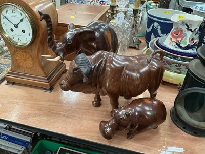 Lot 468 - Three African carved hardwood sculptures depicting an elephant, rhinoceros and buffalo (3)