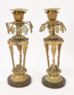 Lot 809 - Pair of Regency style ormolu candlesticks