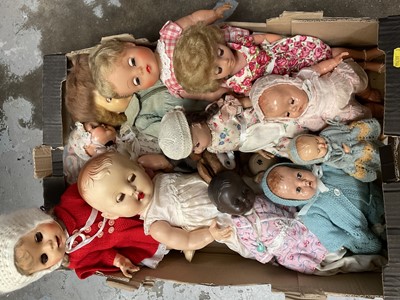 Lot 231 - Vintage dolls and and a collection of dolls clothes