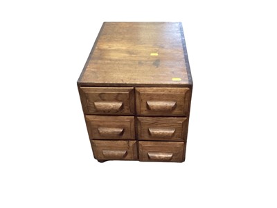 Lot 1241 - Edwardian light oak desk top filing chest of six drawers