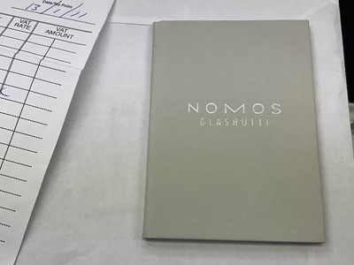 Lot 522 - Nomos Orion watch and papers