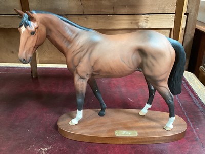 Lot 675 - Royal Doulton pottery figure of a racehorse 'Troy' on wooden plinth