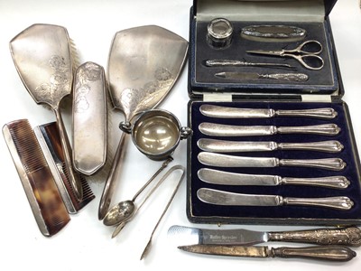 Lot 1048 - 1960s silver dressing table set, silver mounted manicure set in case, set of six silver handled butter knives in fitted case and other silver items