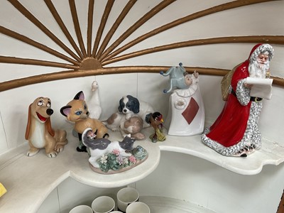 Lot 847 - Group of ceramic figures, including Royal Doulton Father Christmas, Wade, Lladro, etc