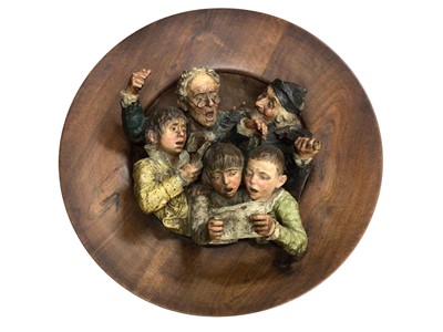 Lot 101 - Large antique Austrian terracotta relief plaque of a choir, mounted in a wooden frame, the whole measuring 68cm diameter