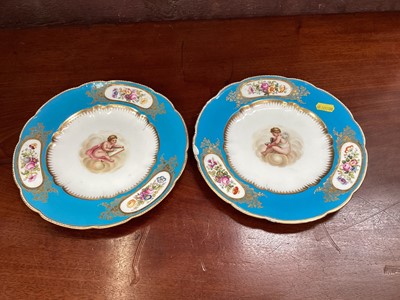 Lot 725 - Pair of 19th century dresden style porcelain plates, painted with cherubs on a bleu celesete ground