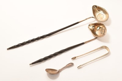 Lot 259 - Two silver punch ladles with twisted handles, a Georgian caddy spoon and pair Georgian sugar tongs