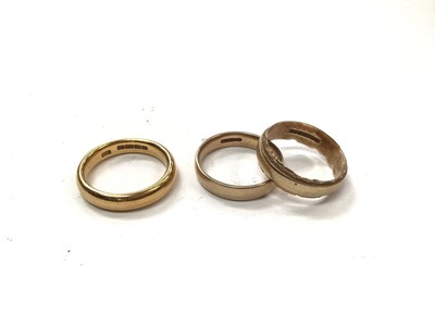 Lot 1050 - 22ct gold wedding ring and two 9ct gold wedding rings (3)