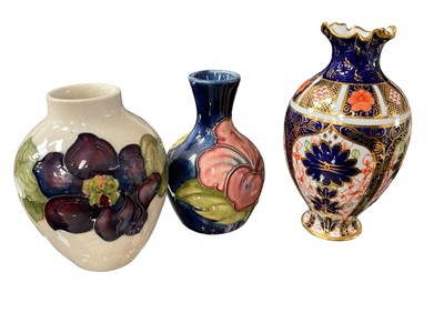 Lot 172 - Two small Moorcroft vases and a Royal Crown Derby Imari 1128 vase